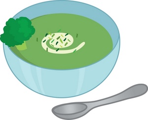a healthy bowl full of cream of broccoli soup with spoon